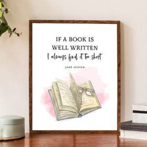 Framed art with a book and a quote that reads 